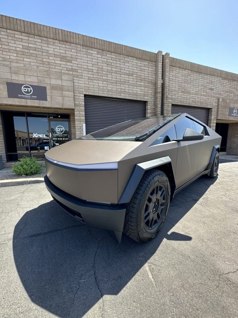 A car parked in front of a building on the street.